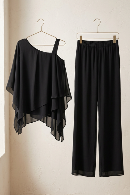Ensemble Côme noir, haut asymétrique et pantalon sur cintres
